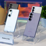 Samsung Galaxy S26 series smartphones displayed on stands showcasing rear camera design and color variants.